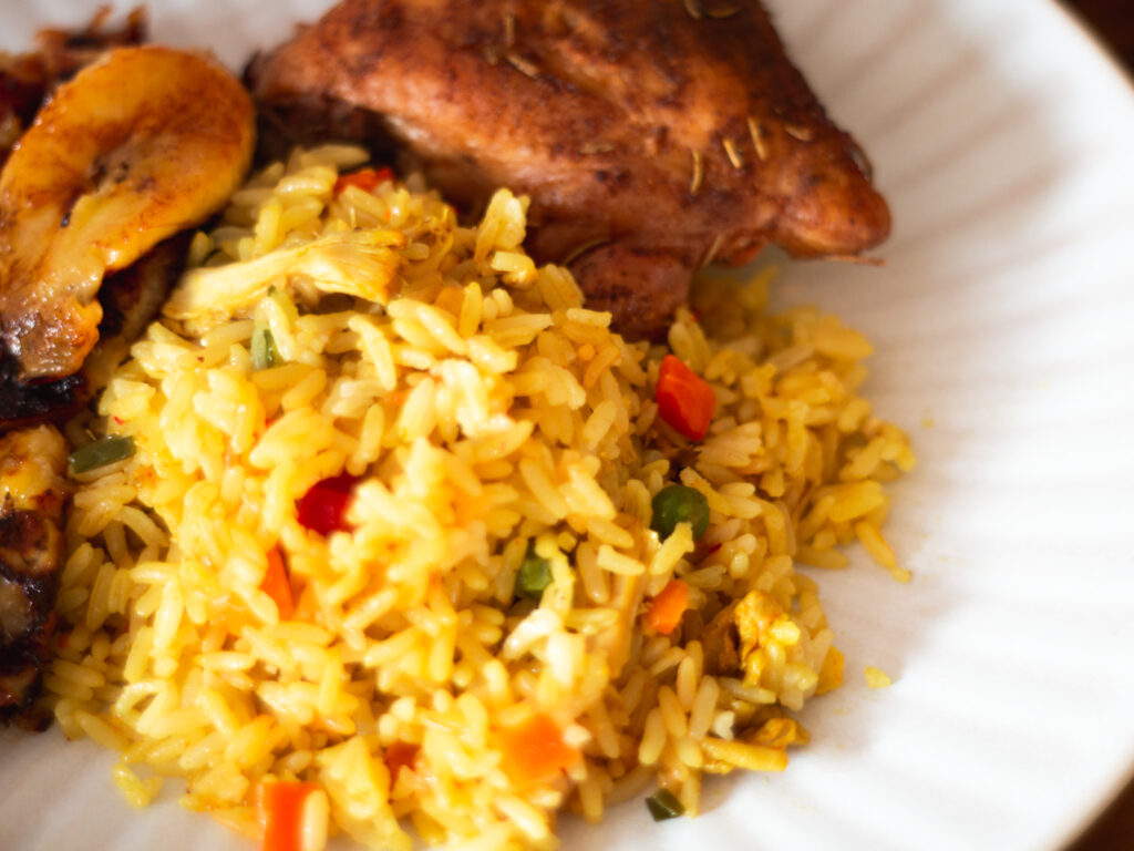 Nigerian Coconut Rice with Chicken and Fried Plantain