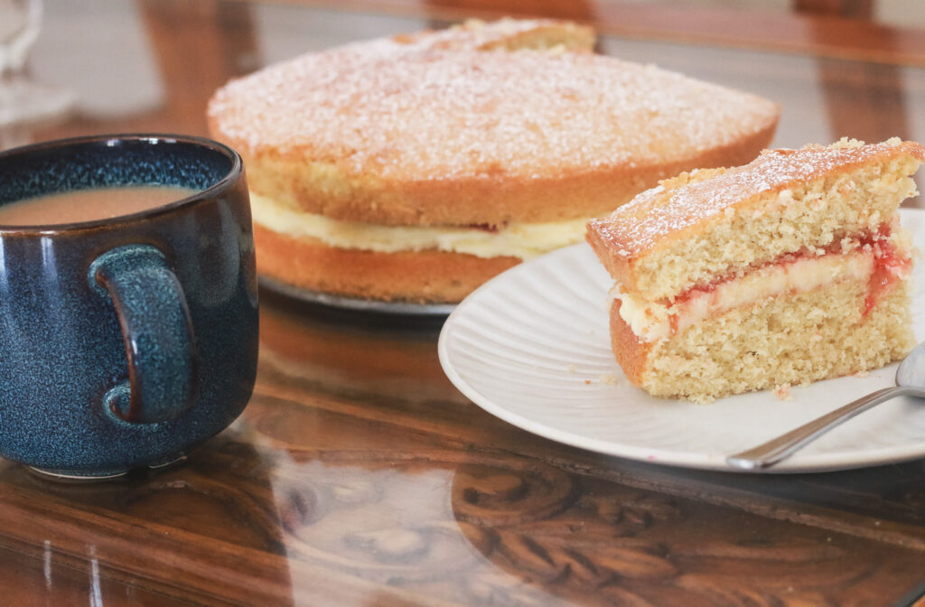 Enjoy a cuppa tea with a slice of victoria sponge cake made with coconut flour