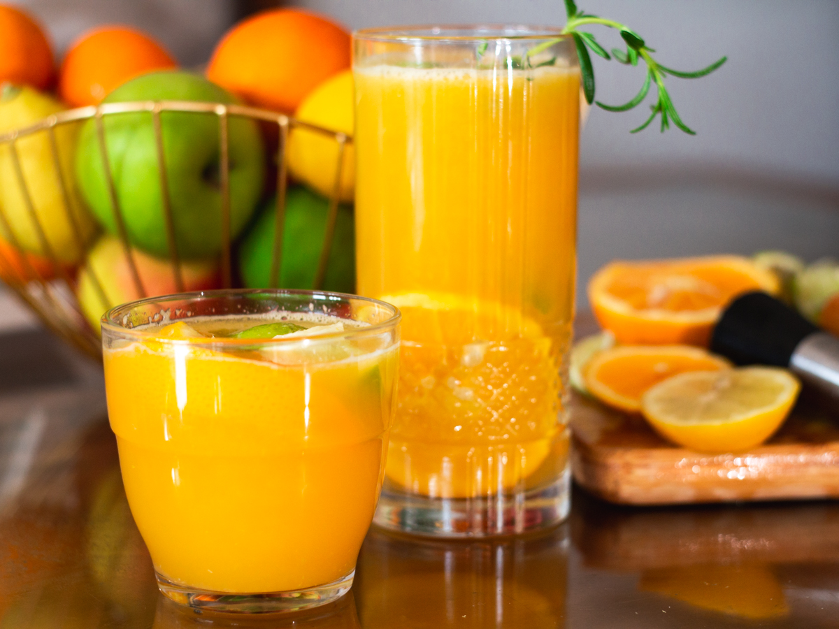glasses of orange lime green tea juice