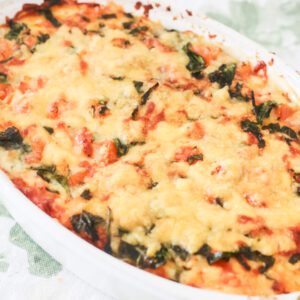 Cheesy sweet potato bake in an oval baking dish