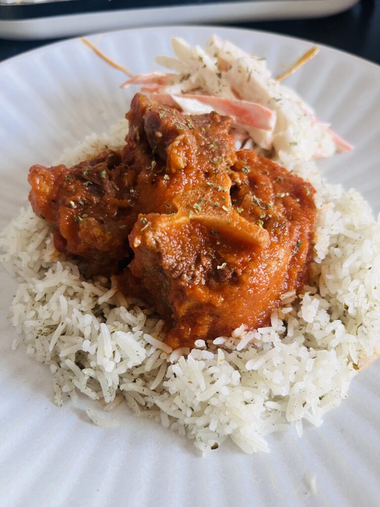 Oxtail stew and rice with coleslaw